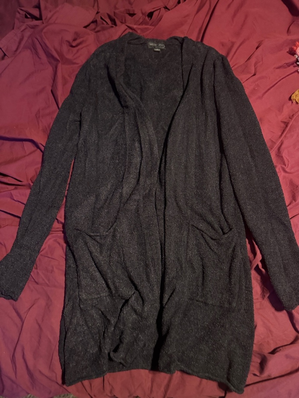 Barefoot dreams Long Open-Front Cardigan in black with pockets.